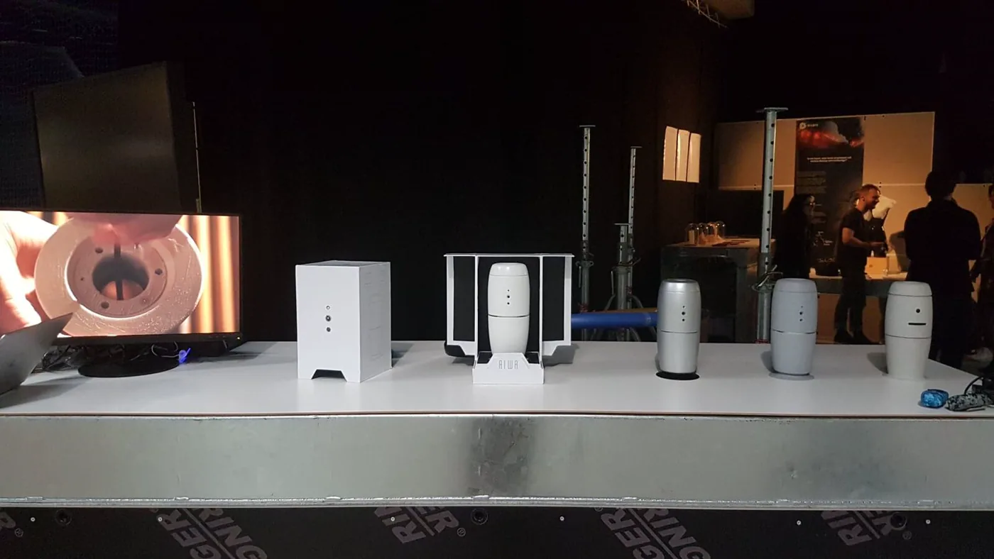 AIWA artefacts presented on a public exhibition display table.